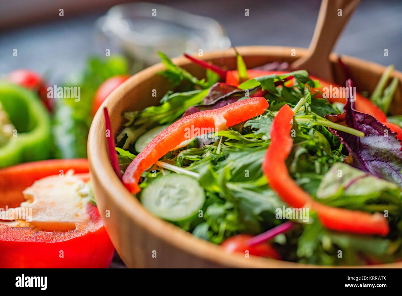 Fresh rustic vegetable salad on rustic background Stock Photo - Alamy