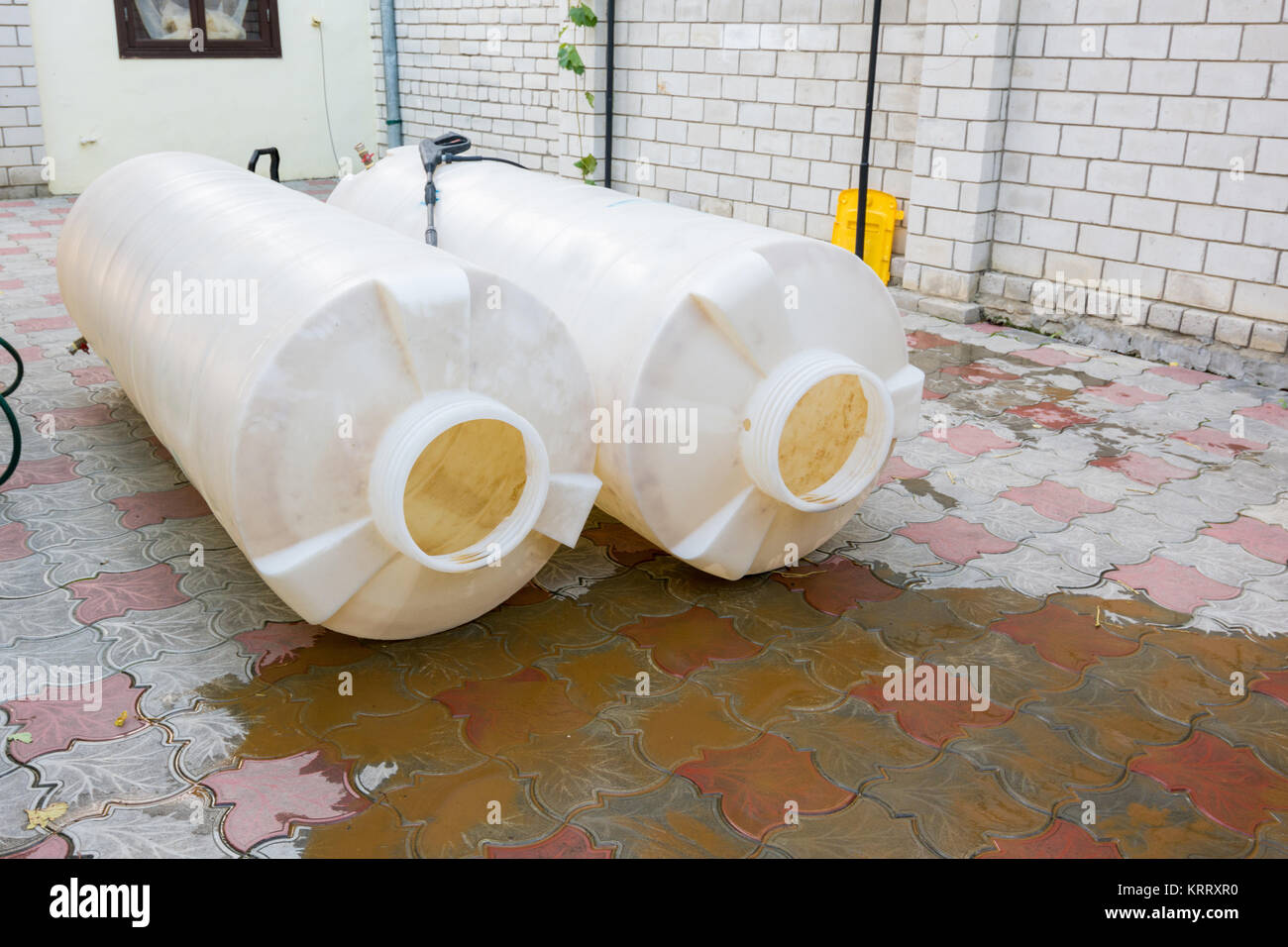 Cleaning plastic tanks volume of one cubic meter of drinking water, dirty rusty sediment Stock Photo