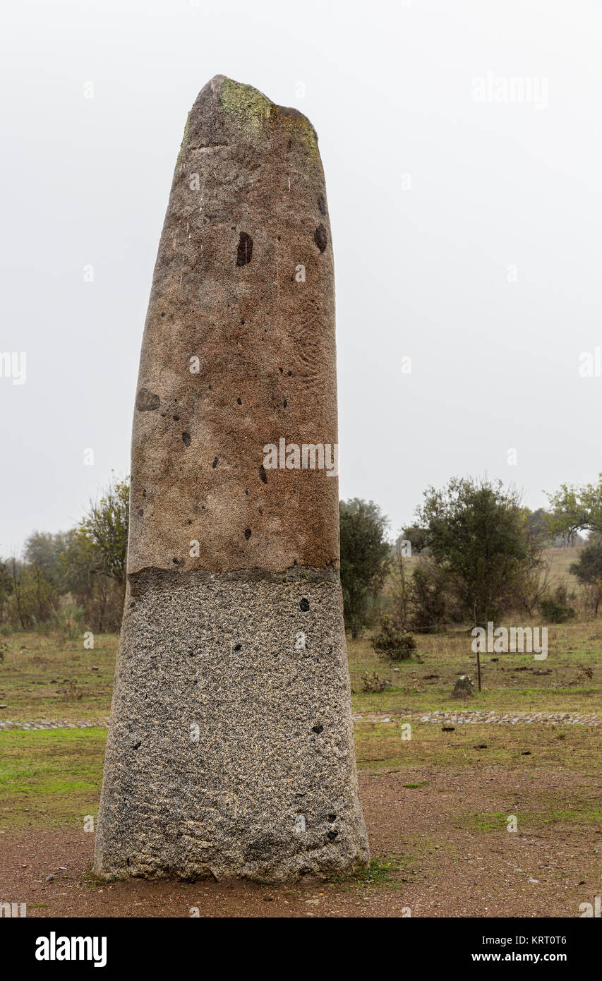 Megalithic monument. The Menhir of Belhoa (Menhir de Belhoa) is single standing stone near Monsaraz in Portugal dating from 5000-4000 BC. Stock Photo