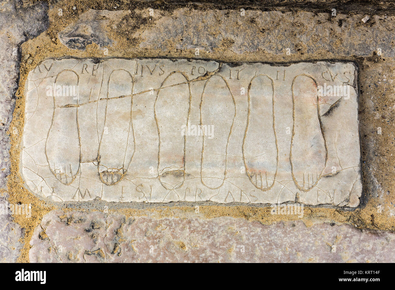 Santiponce, Spain - March 9, 2016: Amphitheatre of Italica. Votive tablet on the floor of the entrance, dedicated to Nemesis. talica; north of modern  Stock Photo