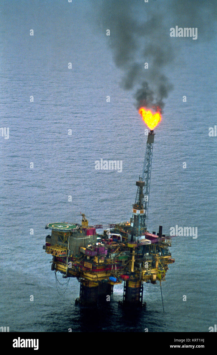 Oil rig in the North Sea. Gas is flared. Aerial view. Stock Photo