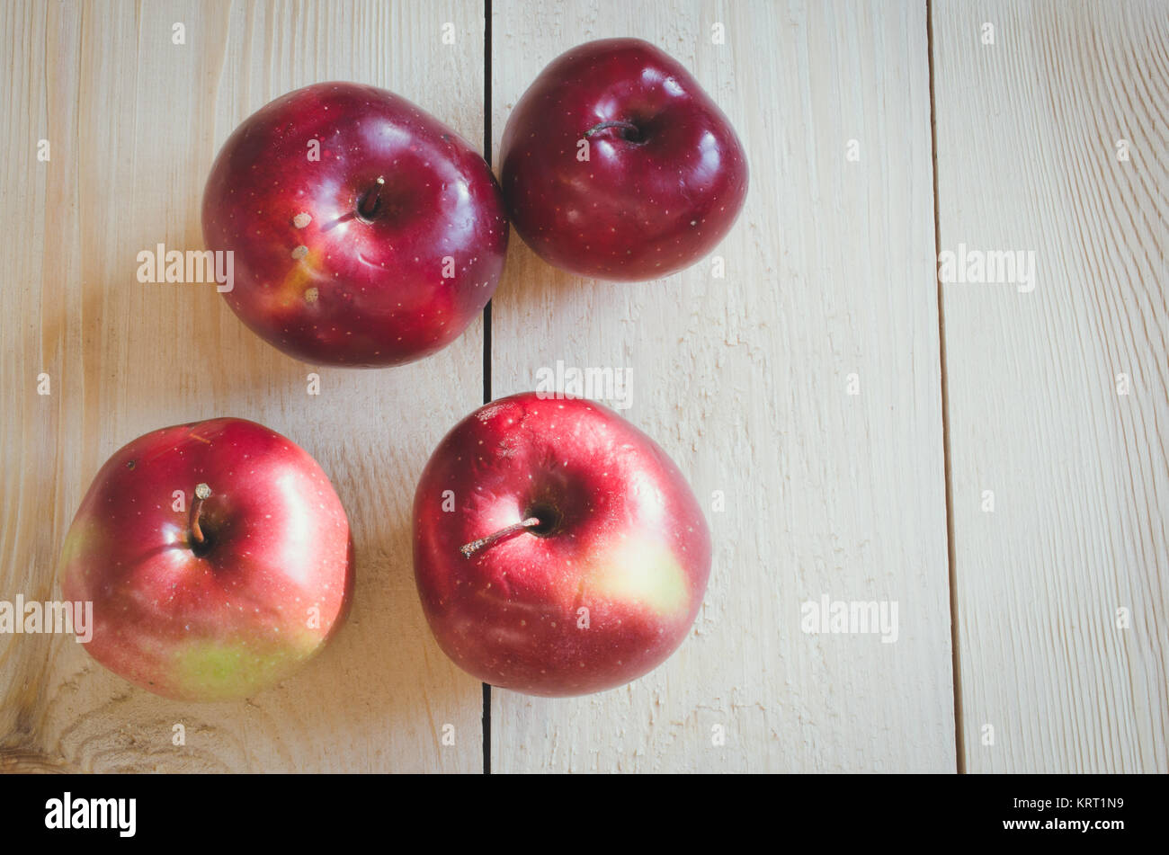 Fresh organic apples on rustic wooden background Stock Photo - Alamy