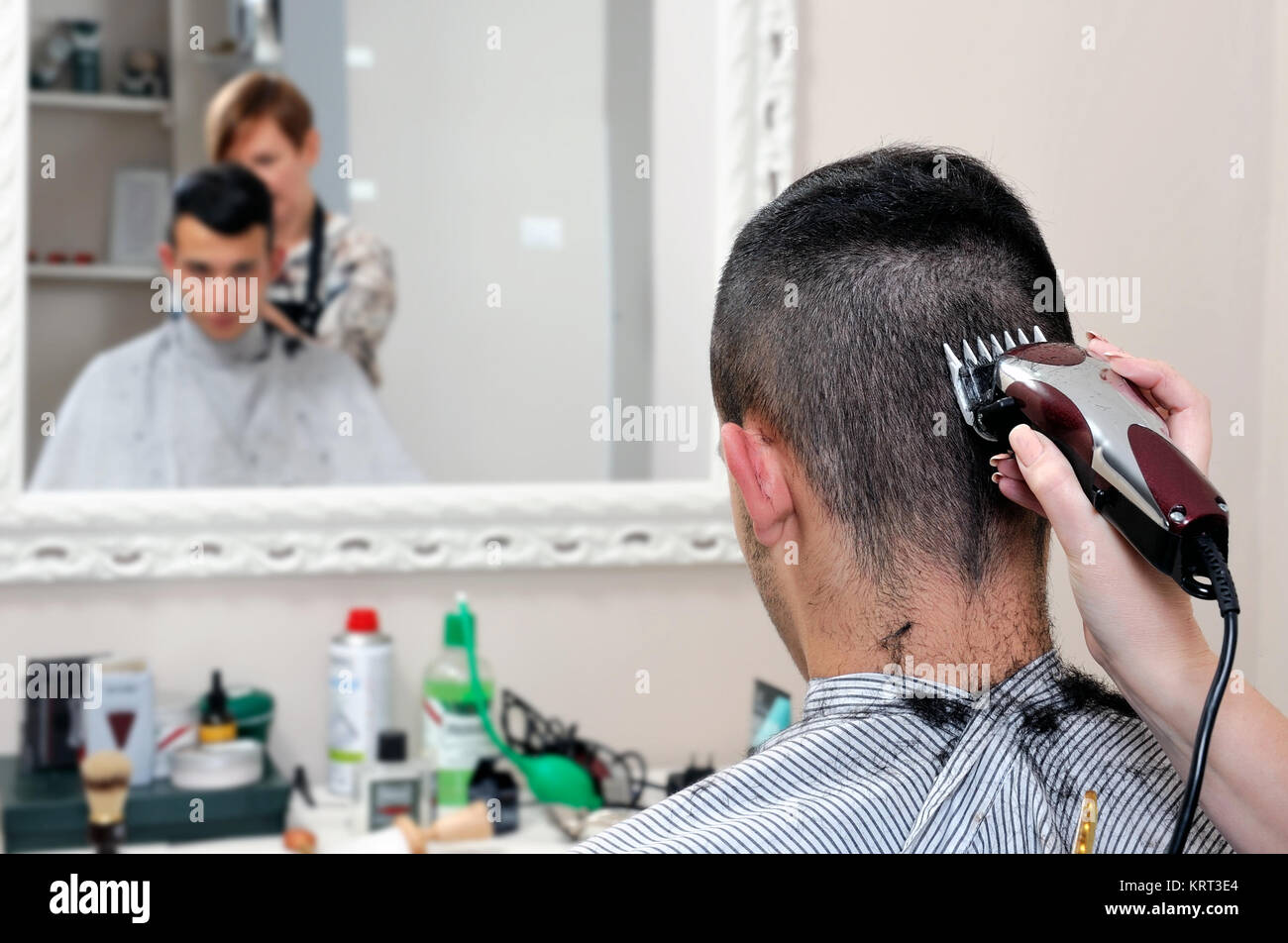 Barber Shop That Performs The Haircut Of A Young Boy With Electric