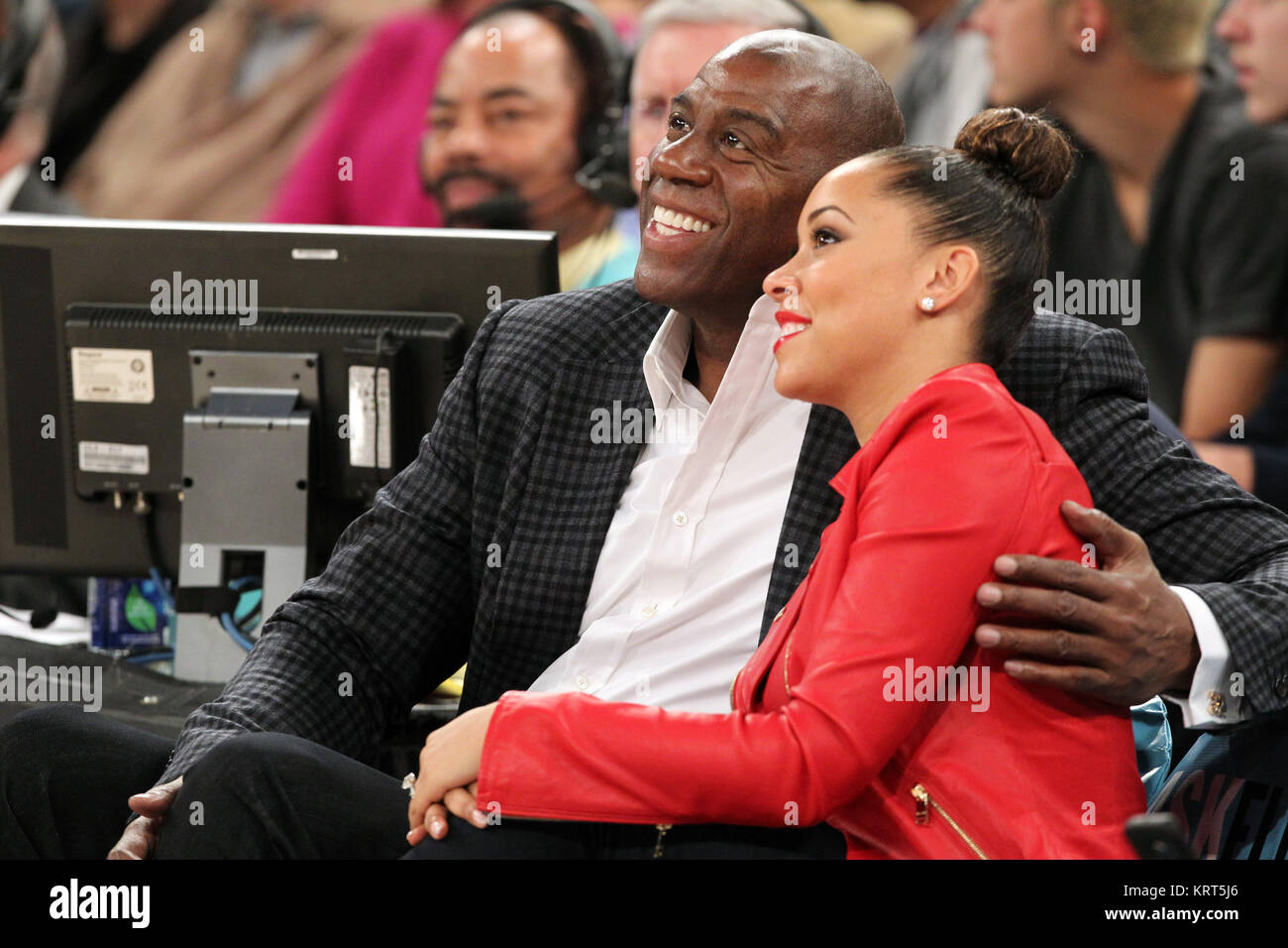 NEW YORK, NY - NOVEMBER 08: (Embargoed till November 10, 2015) Magic Johnson, Tracy Morgan with wife Megan Wollover sit with Michael K. Williams and  Director Spike Lee at the New York Knicks vs Los Angeles Lakers game at Madison Square Garden on November 8, 2015 in New York City.   People:  Magic Johnson, Megan Wollover Stock Photo