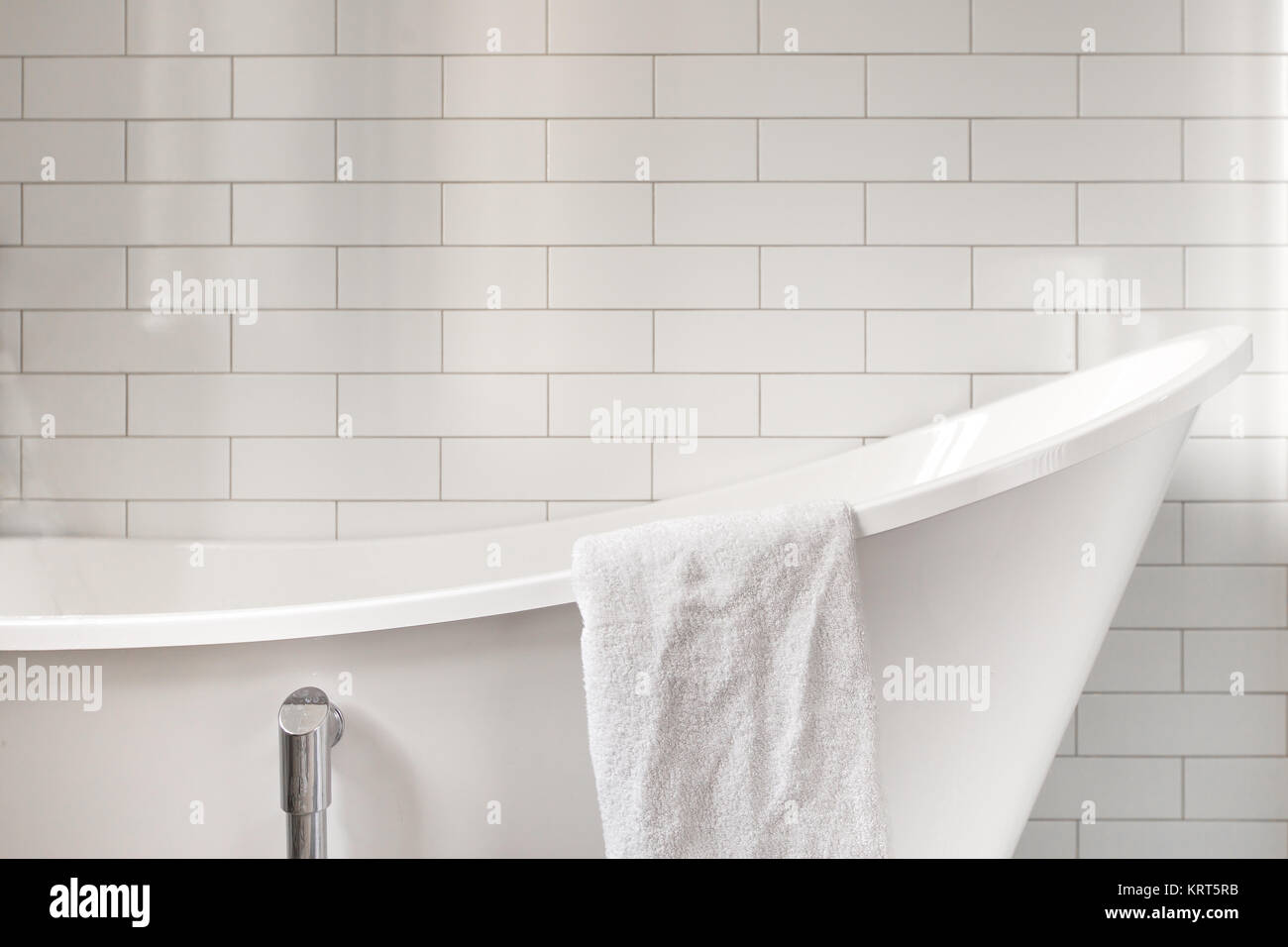 Towel on classic bathroom with old bathtub Stock Photo - Alamy
