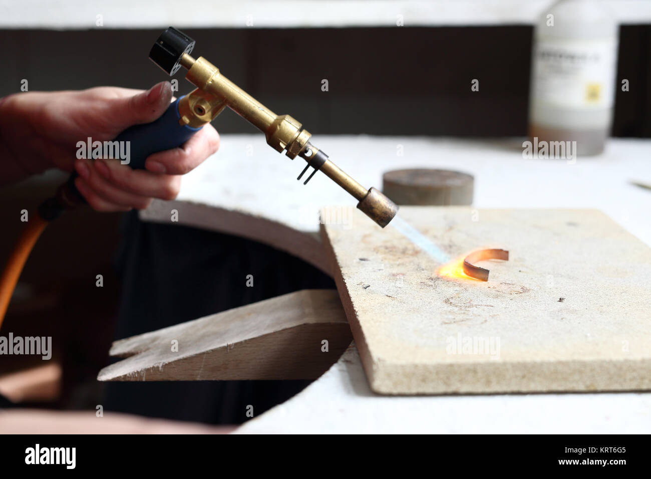 the workshop craftsman,sunbathing gold burner Stock Photo