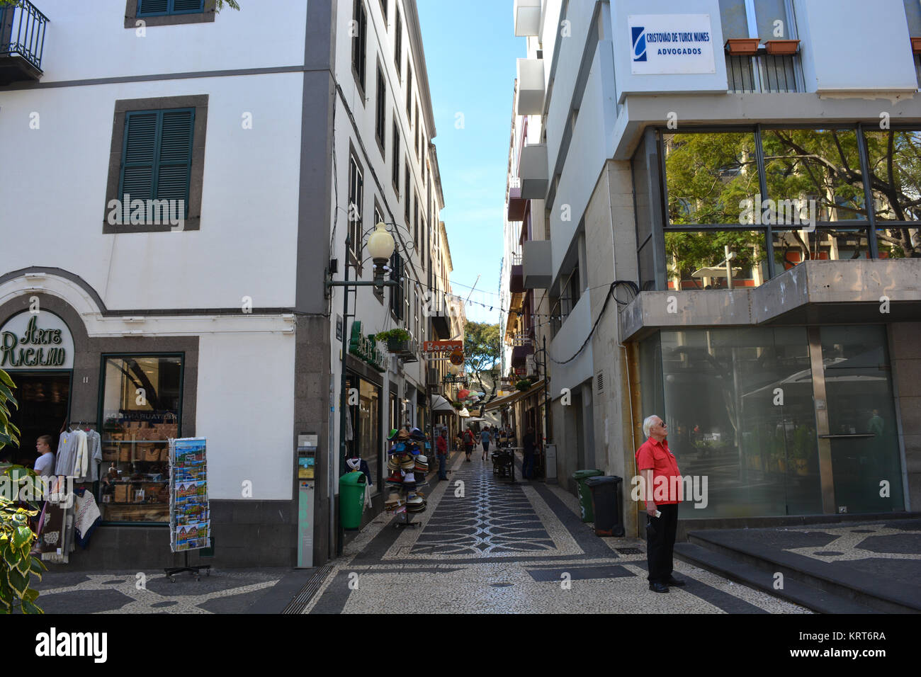 View down a narrow, cobbled, street in the historic old town of Funchal, Madeira, Portugal Stock Photo