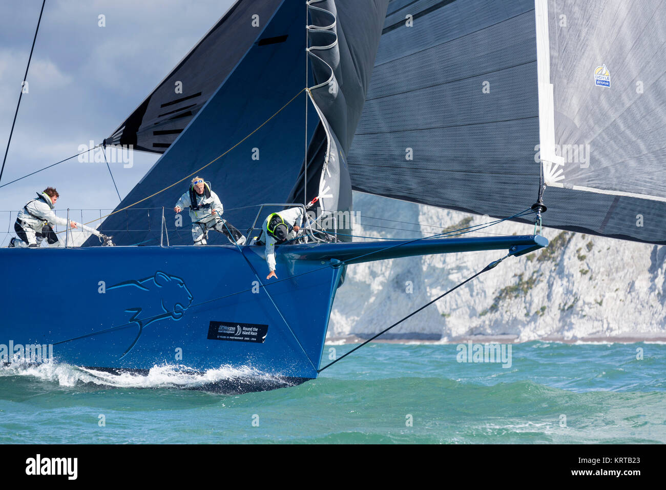 Mike Slade's super maxi, Leopard 3, passes The Needles lighthouse during the Round the Island Race. Isle of Wight. Picture date: Saturday July 2, 2016 Stock Photo