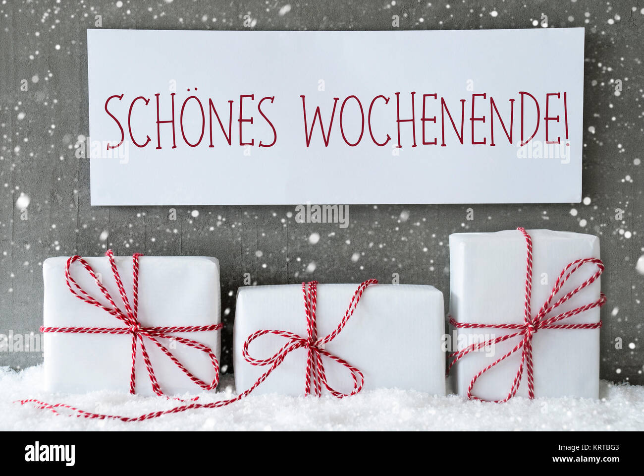 Label With German Text Schoenes Wochenende Means Happy Weekend. Three  Christmas Gifts Or Presents On Snow. Cement Wall As Background With  Snowflakes. Modern And Urban Style Stock Photo - Alamy