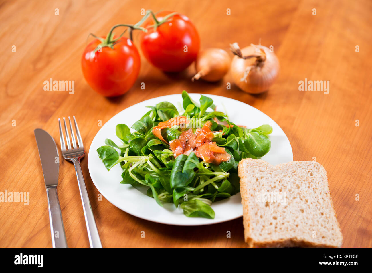 field salad with carrot,tomato,onion and bread Stock Photo Alamy