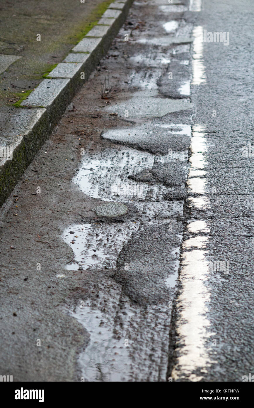 Poor quality broken bicycle / bike / cycle lane / lanes with cracked