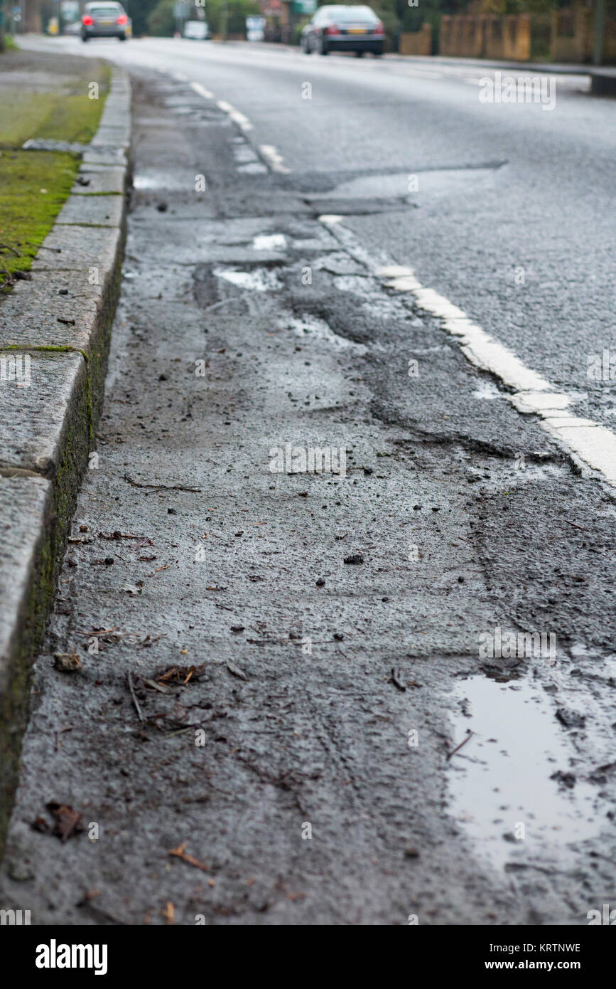Poor quality broken bicycle / bike / cycle lane / lanes with cracked