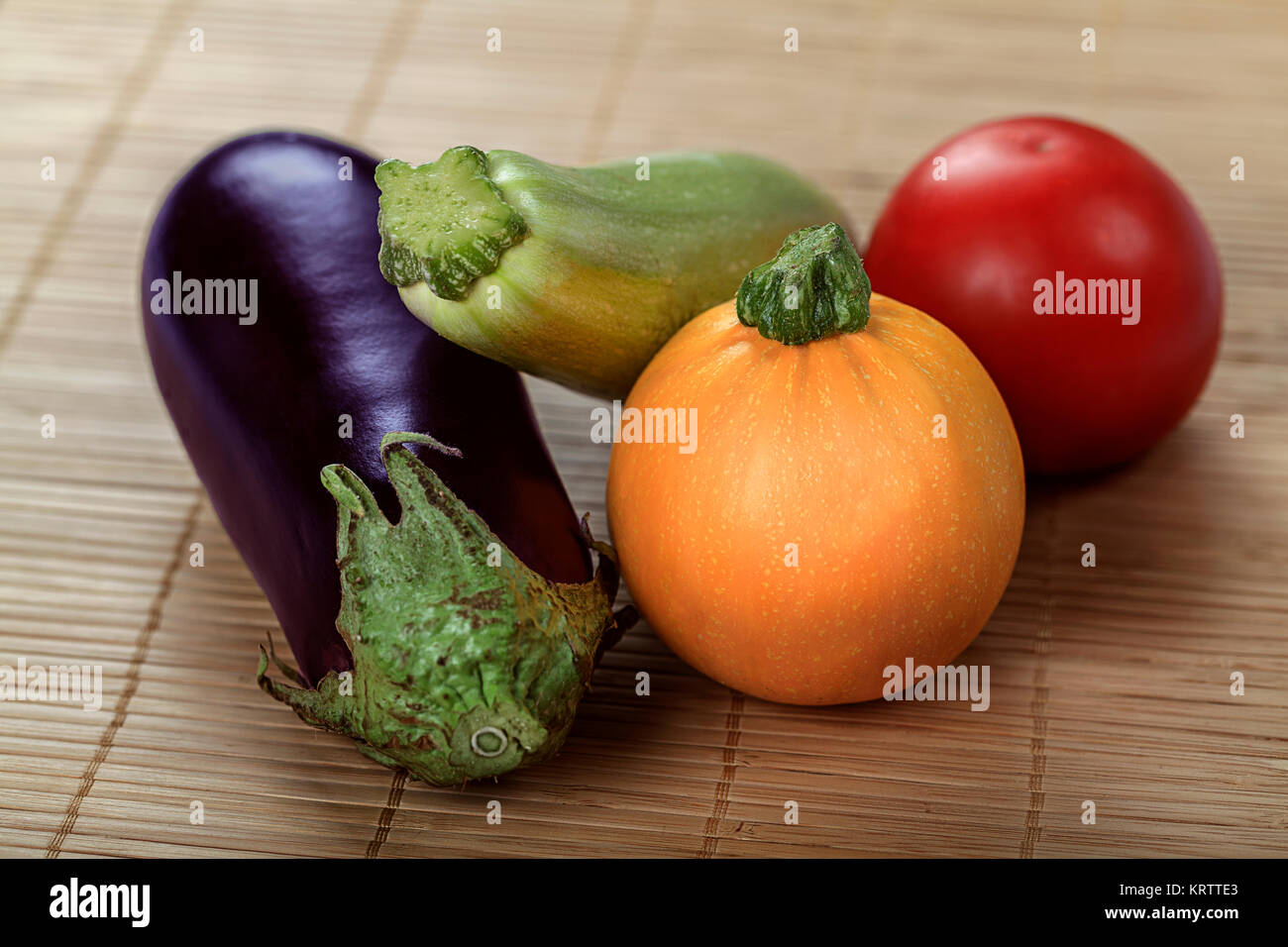 Healthy organic vegetarian diet raw food. Fresh yield of gourd, squash tomato and black eggplant Stock Photo