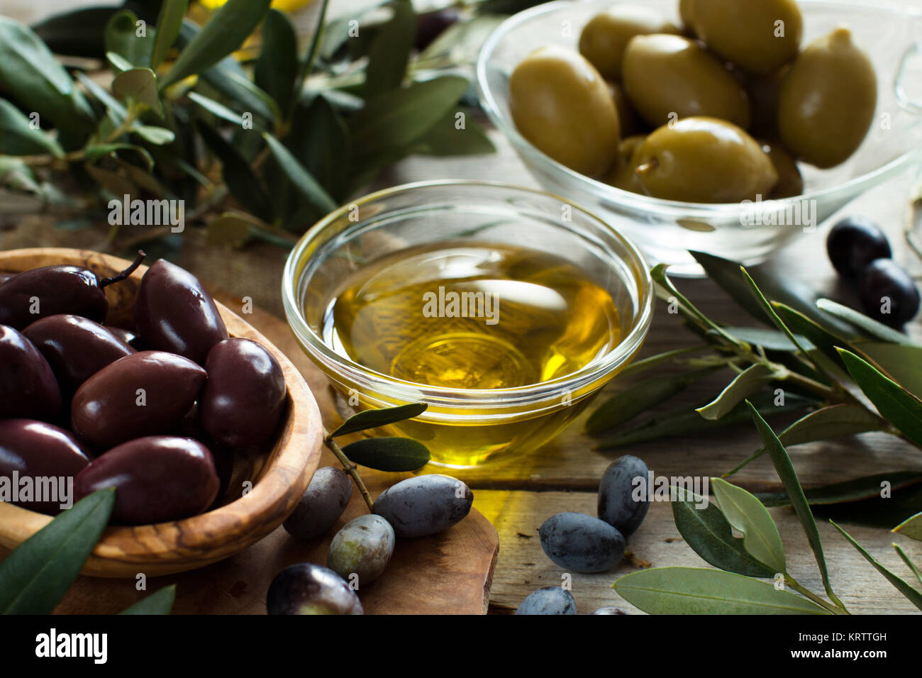 Olive oil and olives on wood background Stock Photo Alamy
