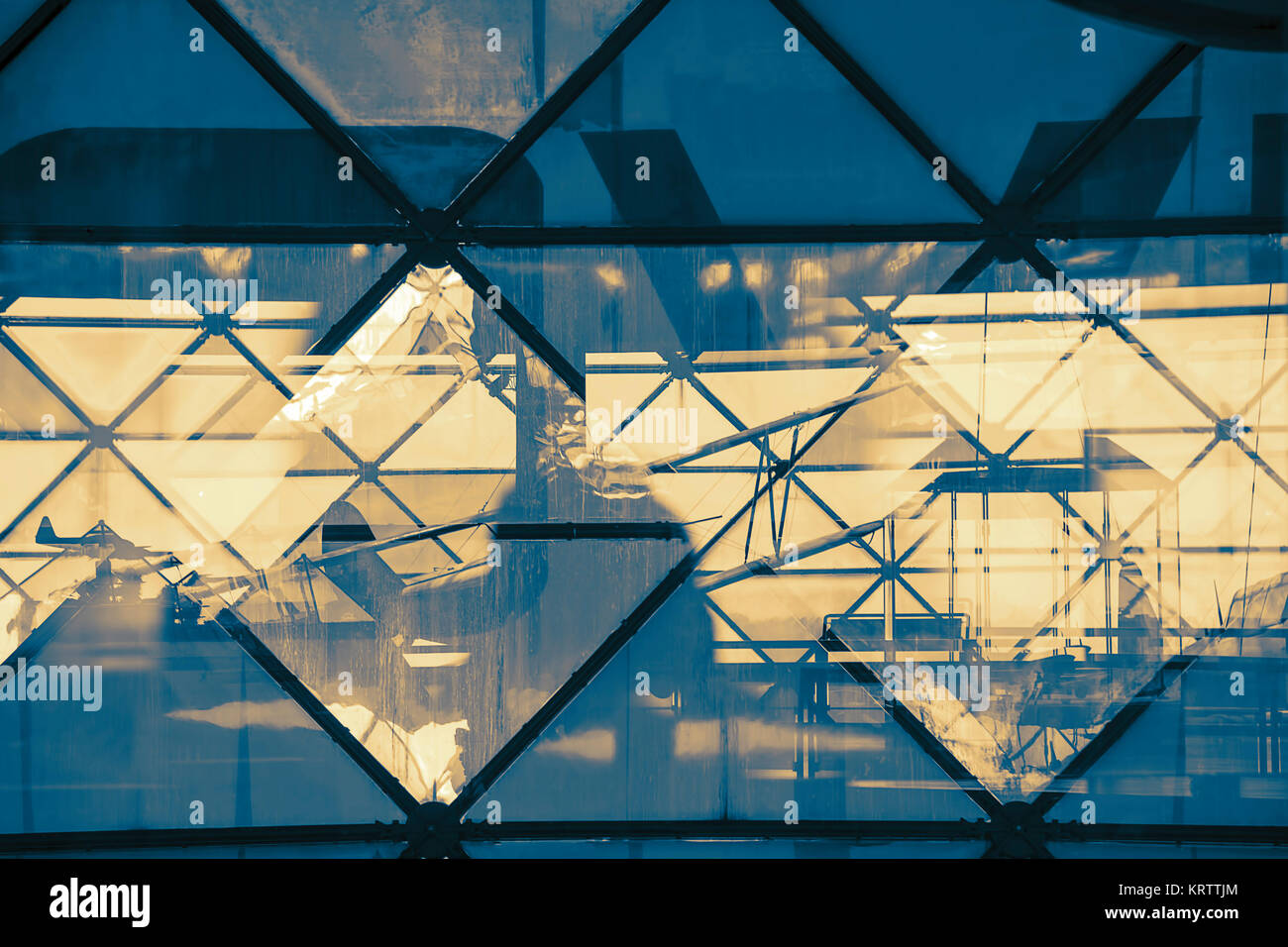 Abstract view through the triangular glass structure with reflection Stock Photo