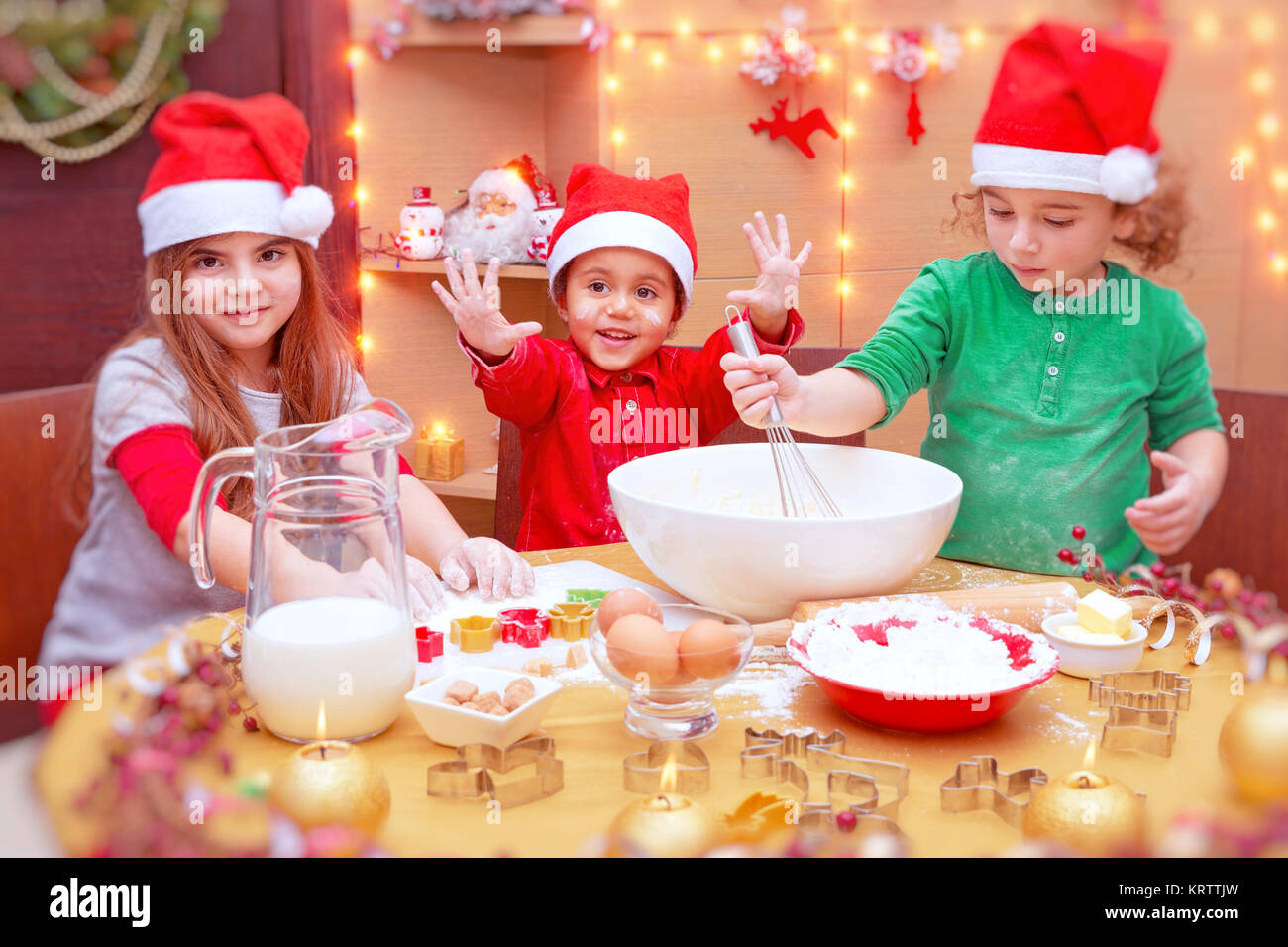 Happy children making cookies Stock Photo - Alamy