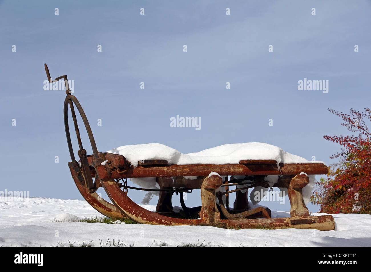 an old sleigh in winter. old transport carriage in the snow Stock Photo