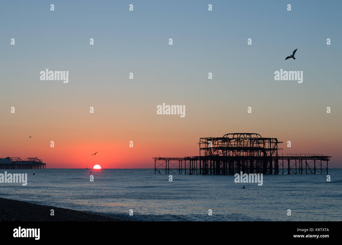Brighton Piers Sunrise Stock Photo