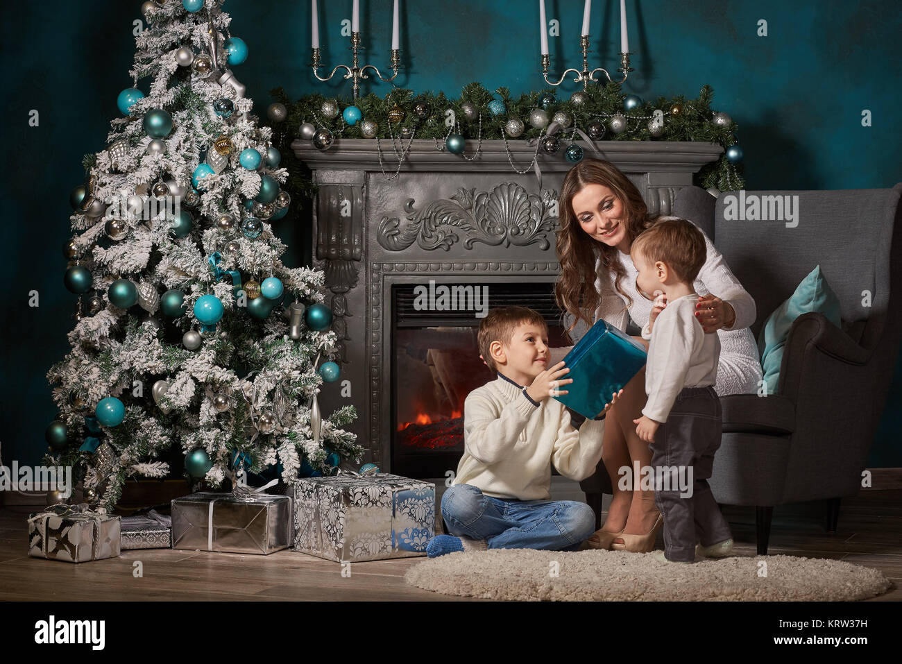 .Happy family with Christmas gifts Stock Photo - Alamy