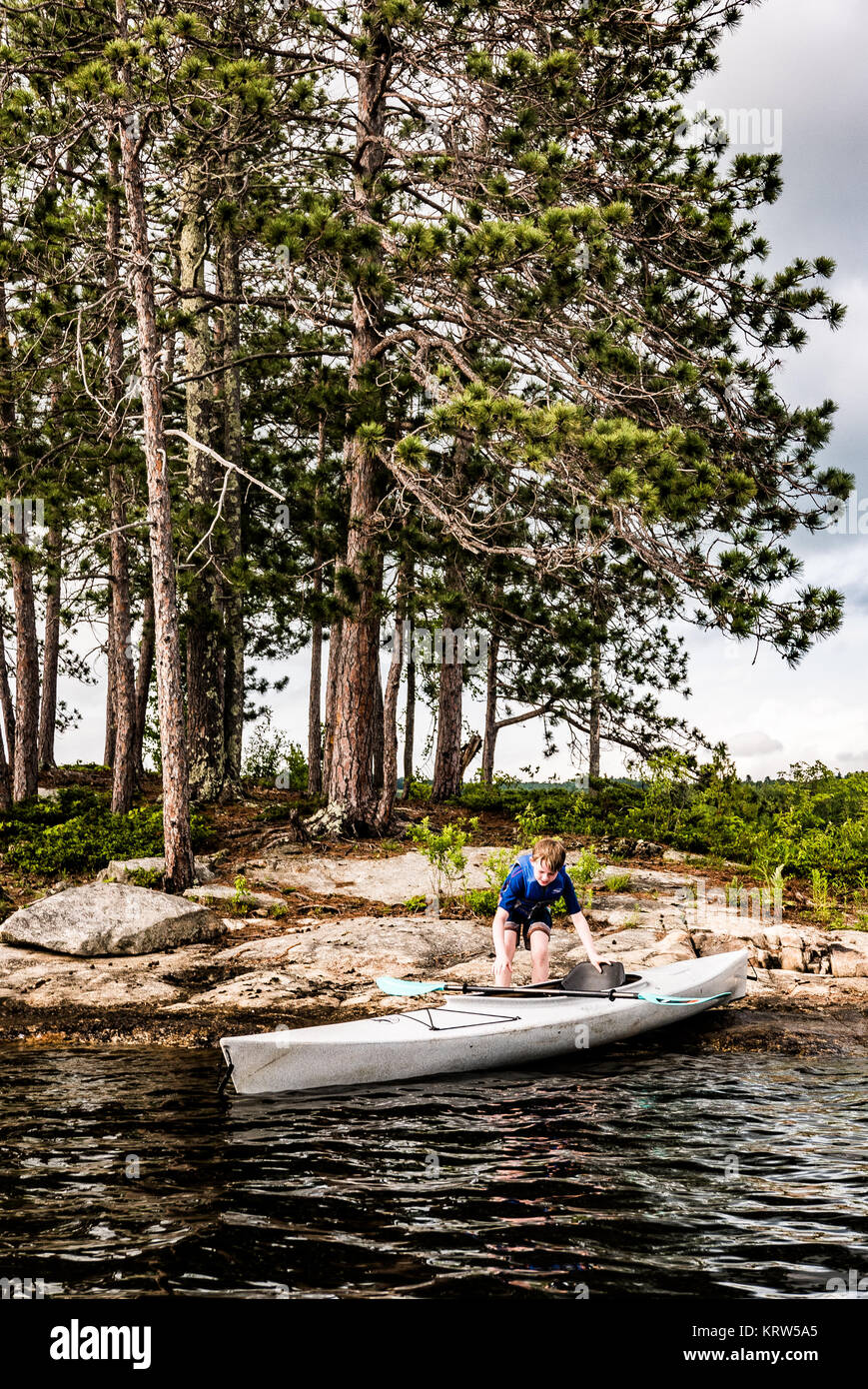 family kayaking on flying pond, mount vernon, maine Stock Photo Alamy