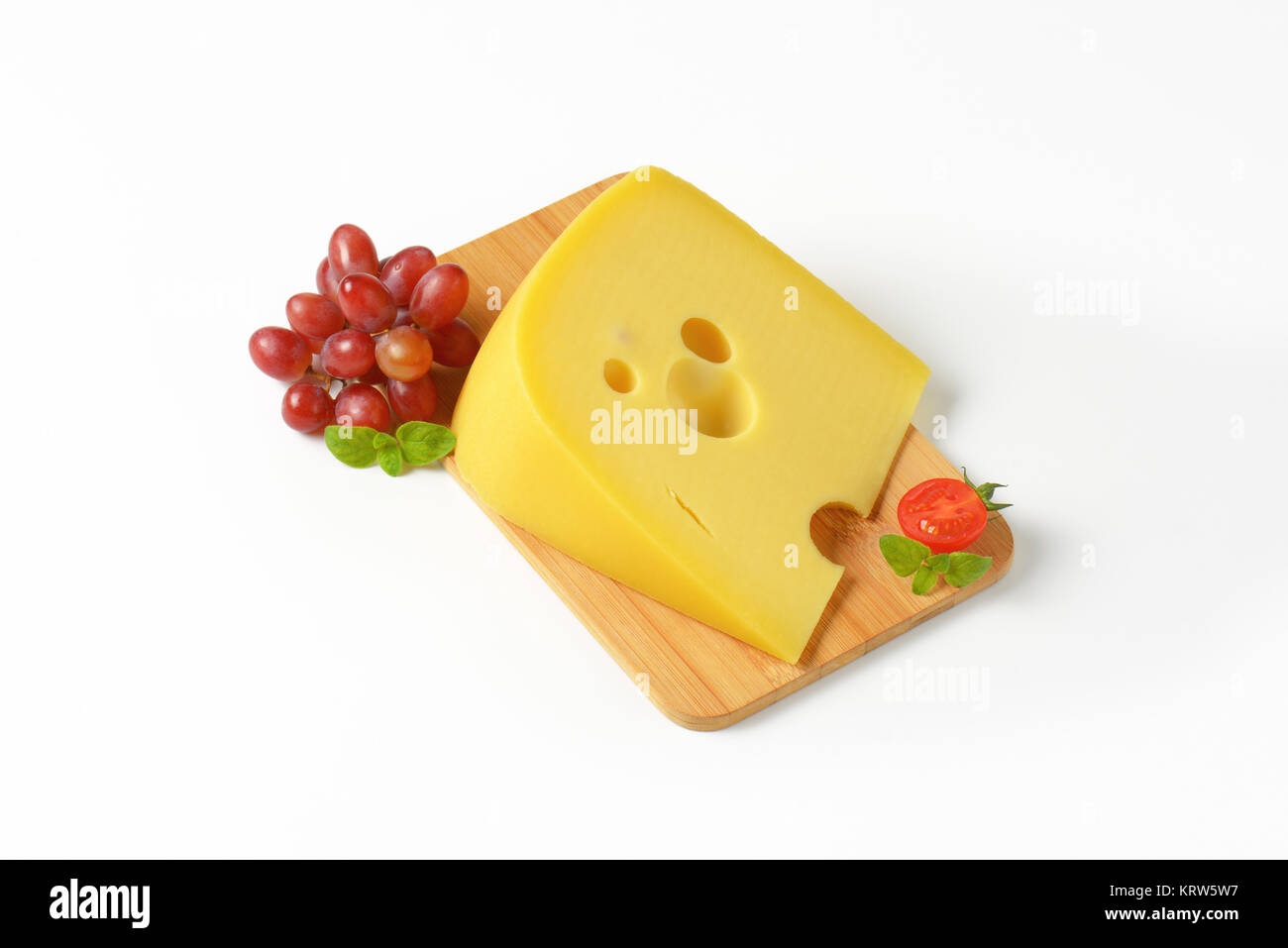 Swiss cheese with red grapes Stock Photo Alamy