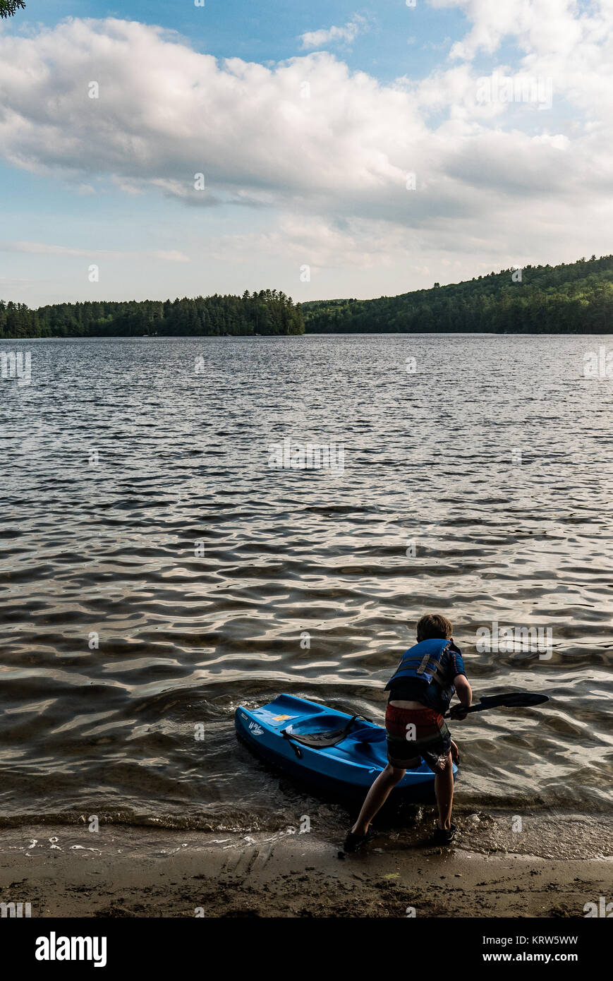 family kayaking on flying pond, mount vernon, maine Stock Photo Alamy