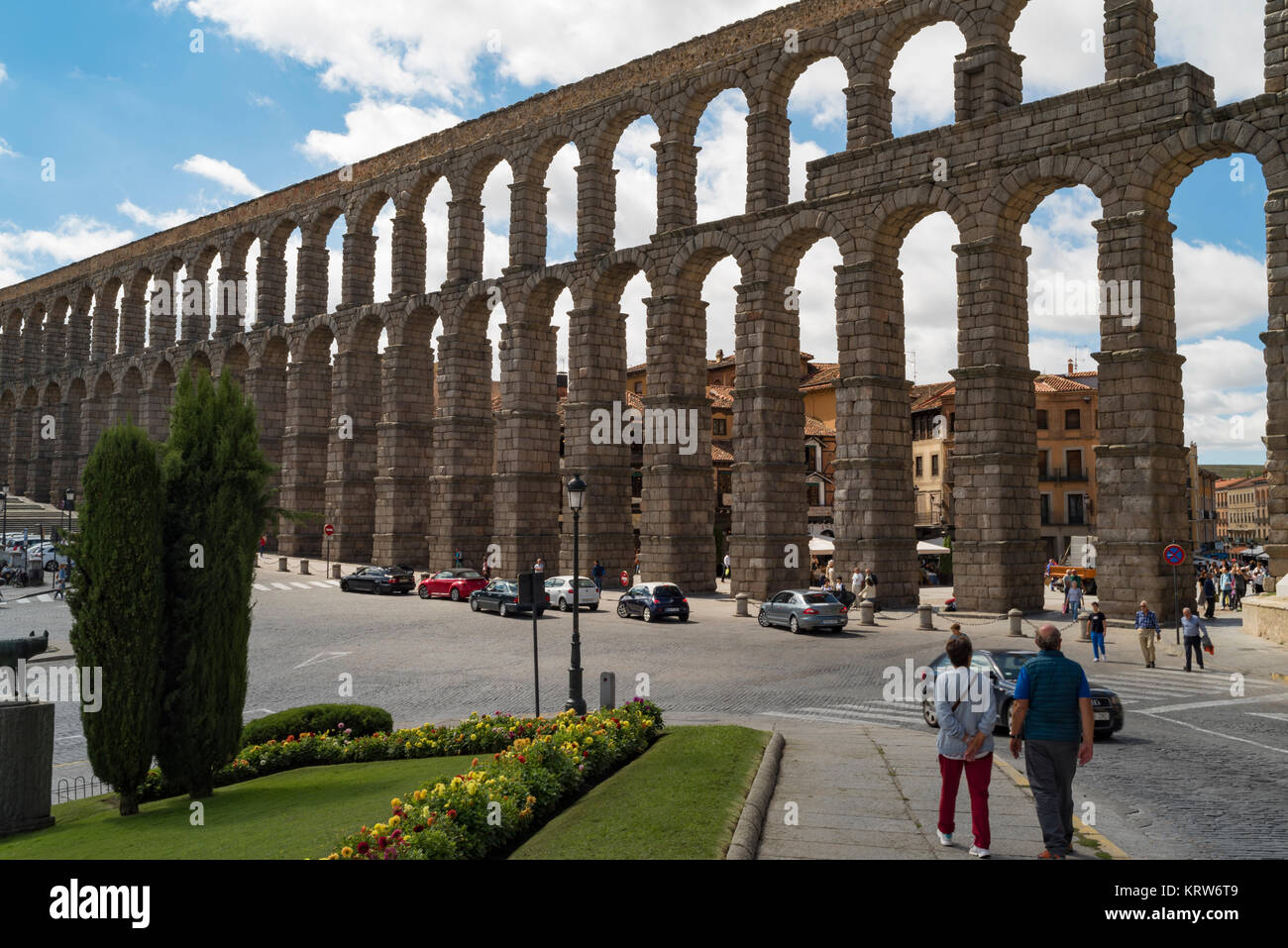 People Stare up at the Roman Aqueduct in Segovia Spain Stock Photo
