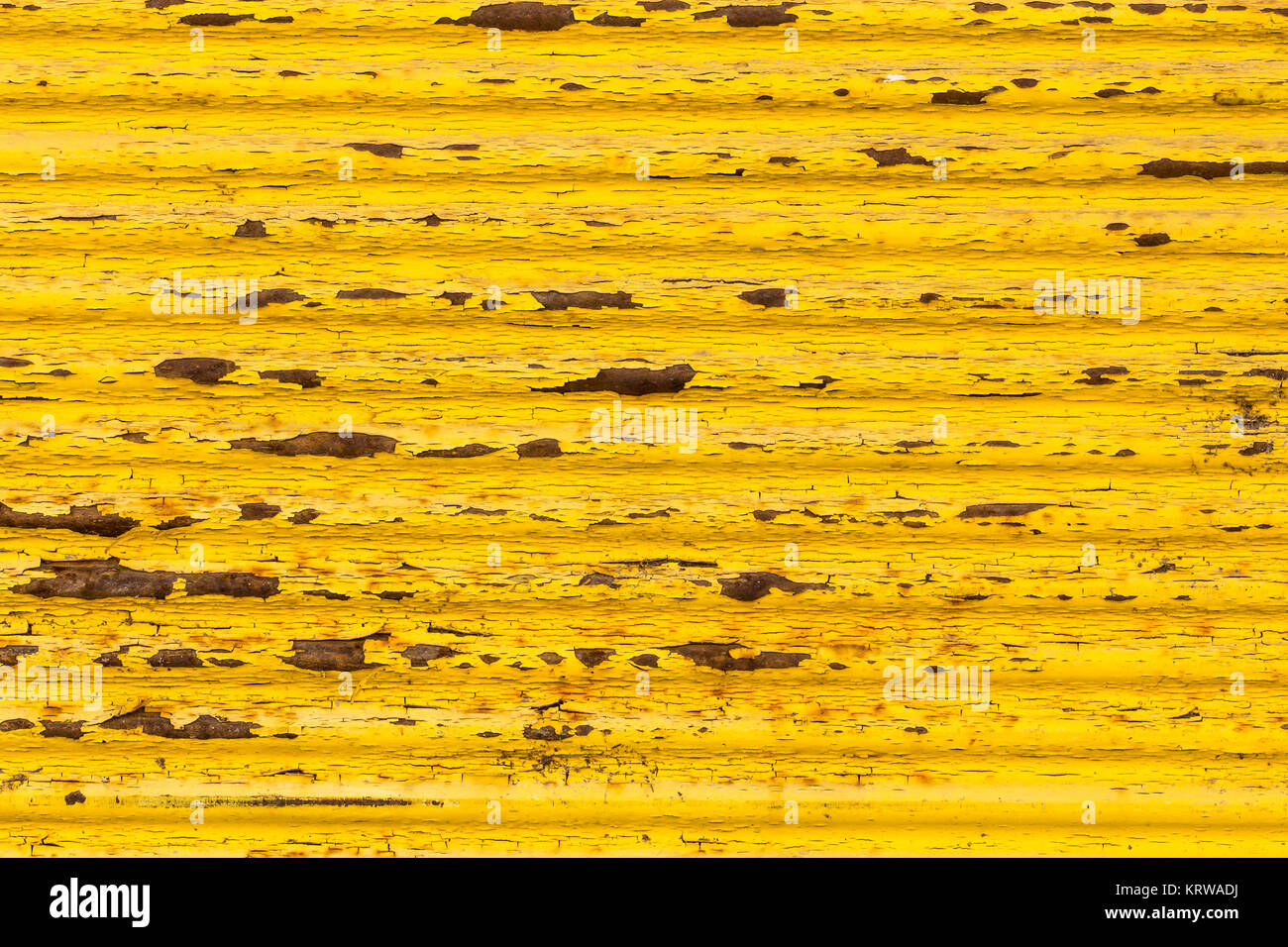 Rusty yellow paint on old fence Stock Photo - Alamy