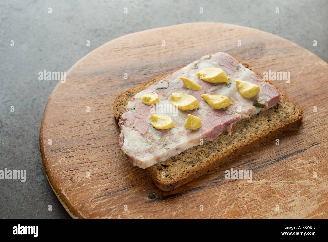 slice of wholemeal bread with soppressata presswurst Stock Photo