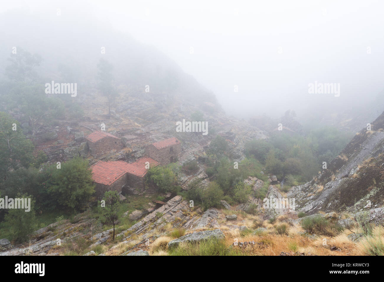 Landscape with fog in Penha Garcia. Portugal. With old water mills. Stock Photo