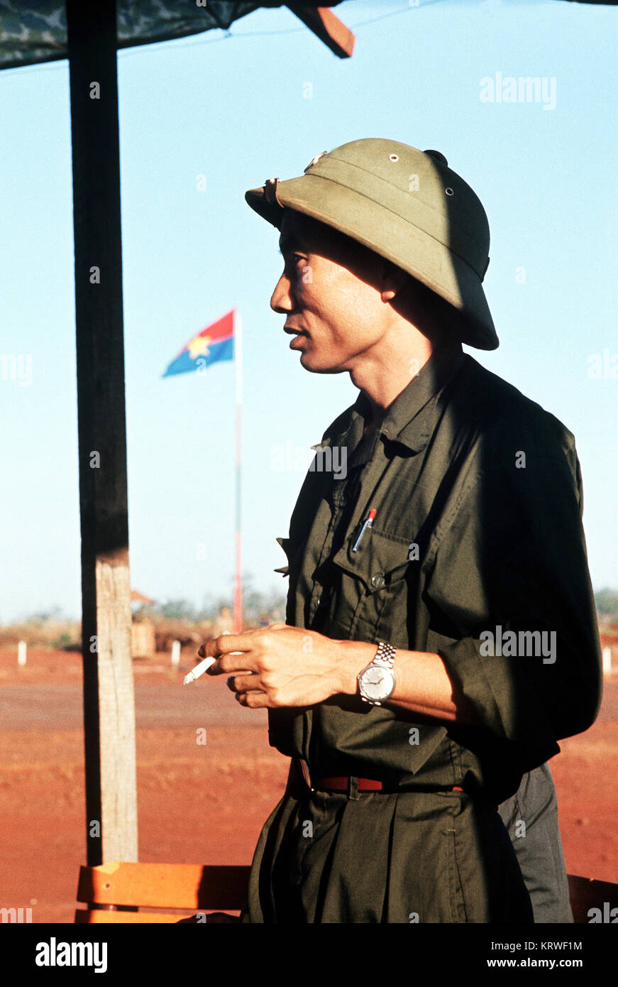 A Viet Cong officer smokes a cigarette. Stock Photo