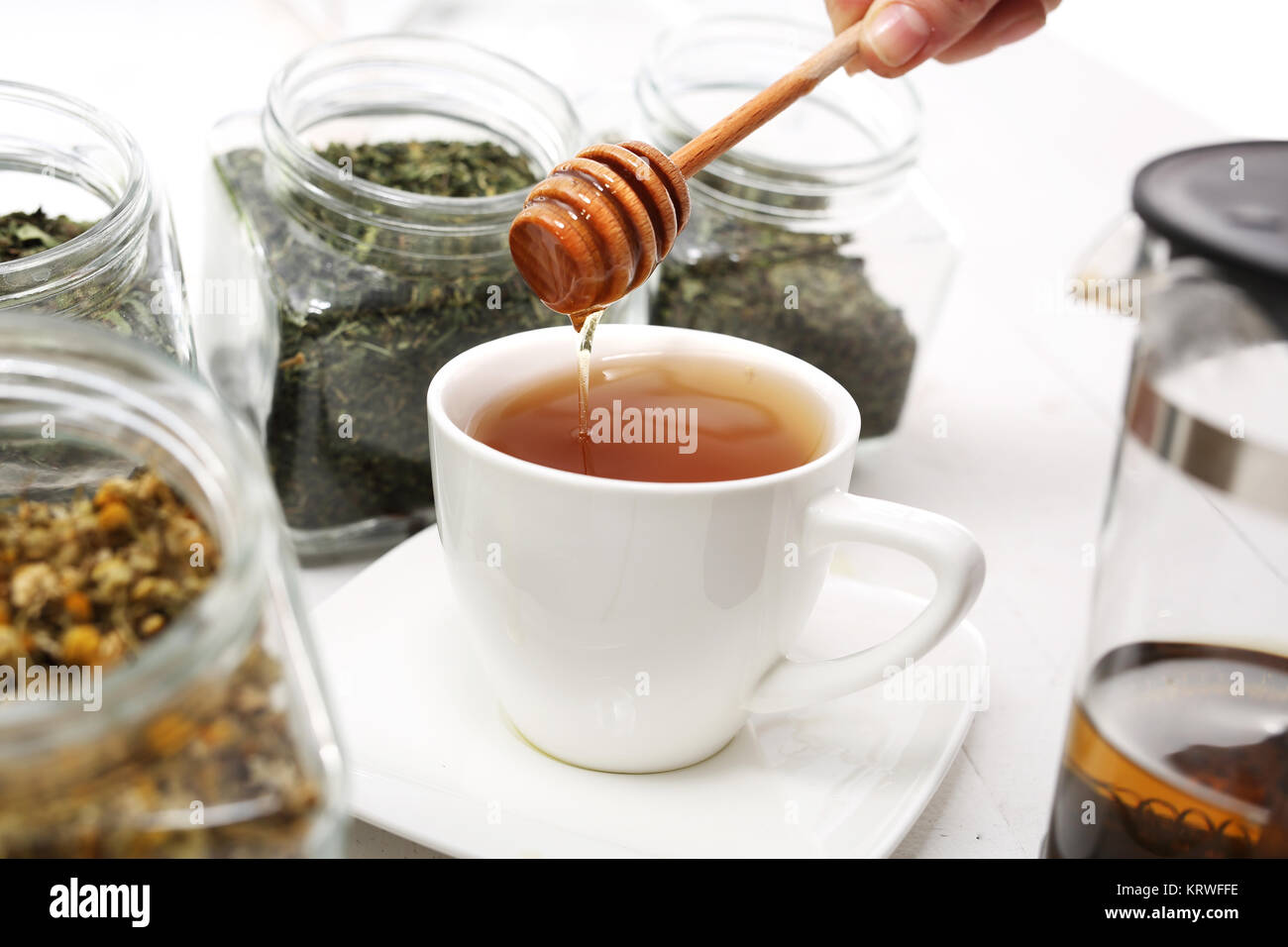 honey,sweetening with honey. tea sweetened with honey Stock Photo Alamy