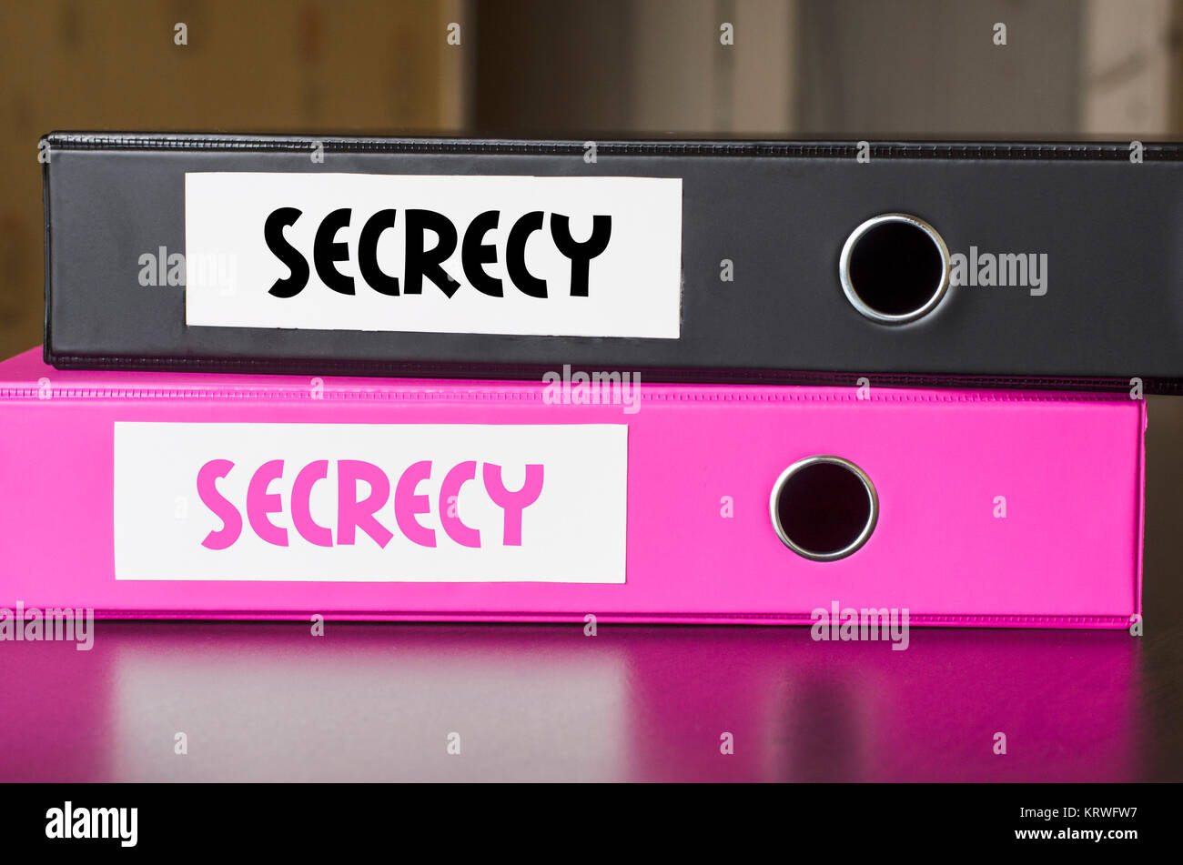 Bright office folders and secrecy text concept Stock Photo - Alamy
