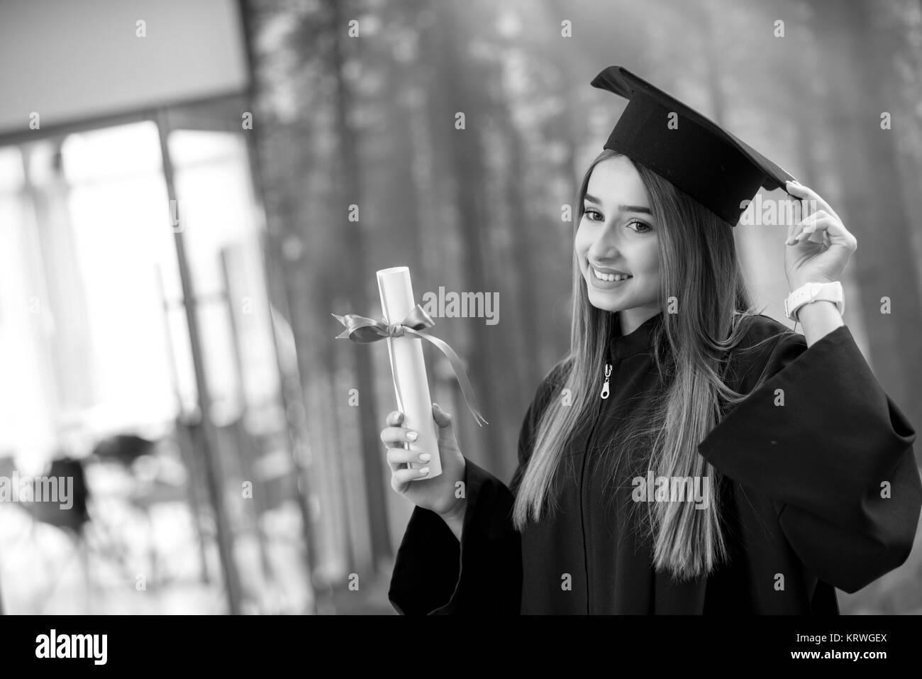 Graduation: Student Standing With Diploma Stock Photo