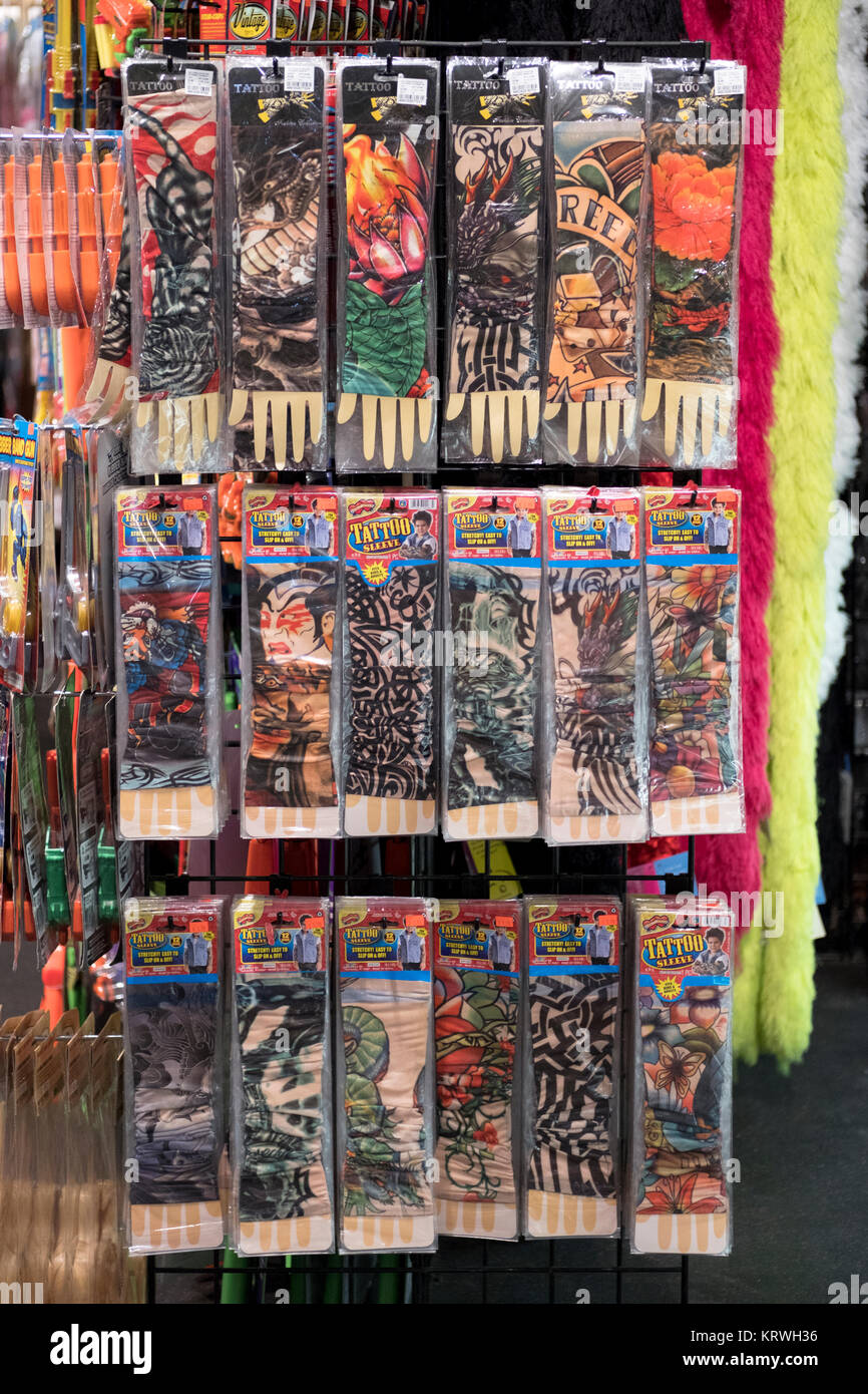 Fake Tattoo sleeves for sale at the Halloween Adventure, a costume store in Greenwich Village, Manhattan, New York City. Stock Photo