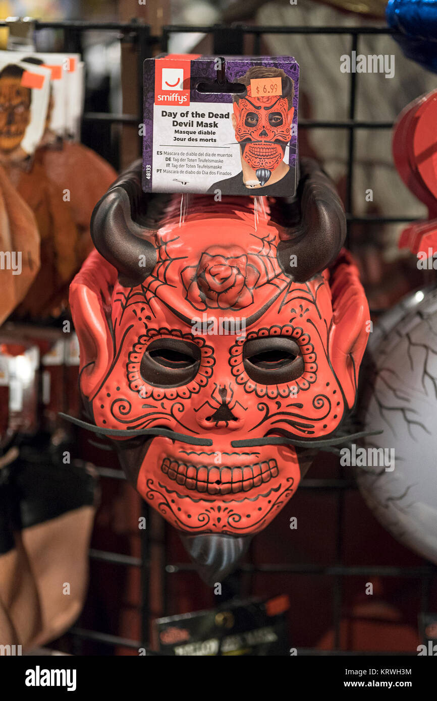 A frightening Day of the Dead Devil mask for sale at the Halloween adventure on Broadway in Greenwich Village, New York City. Stock Photo