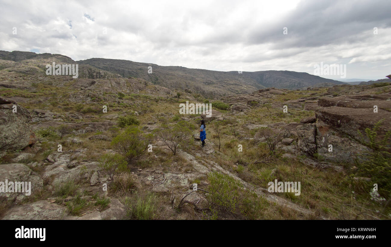 Cordoba, Argentina - 2017: A woman hikes at Cerro Blanco reserve, near Tanti and Los Gigantes in the Altas Cumbres region. Stock Photo
