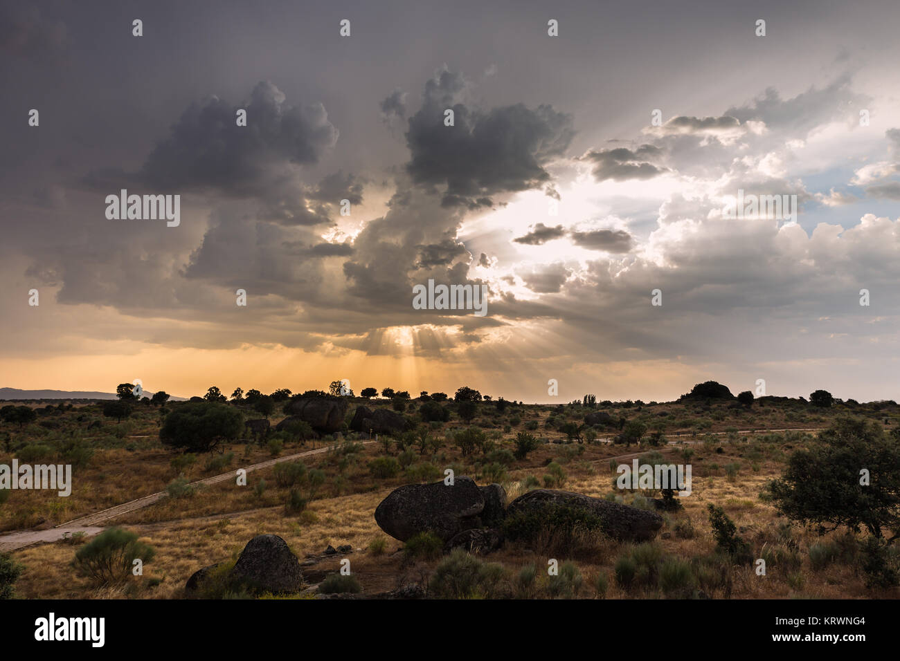 Landscape at sunset with sun rays in the natural area of the Barruecos. Extremadura. Spain. Stock Photo