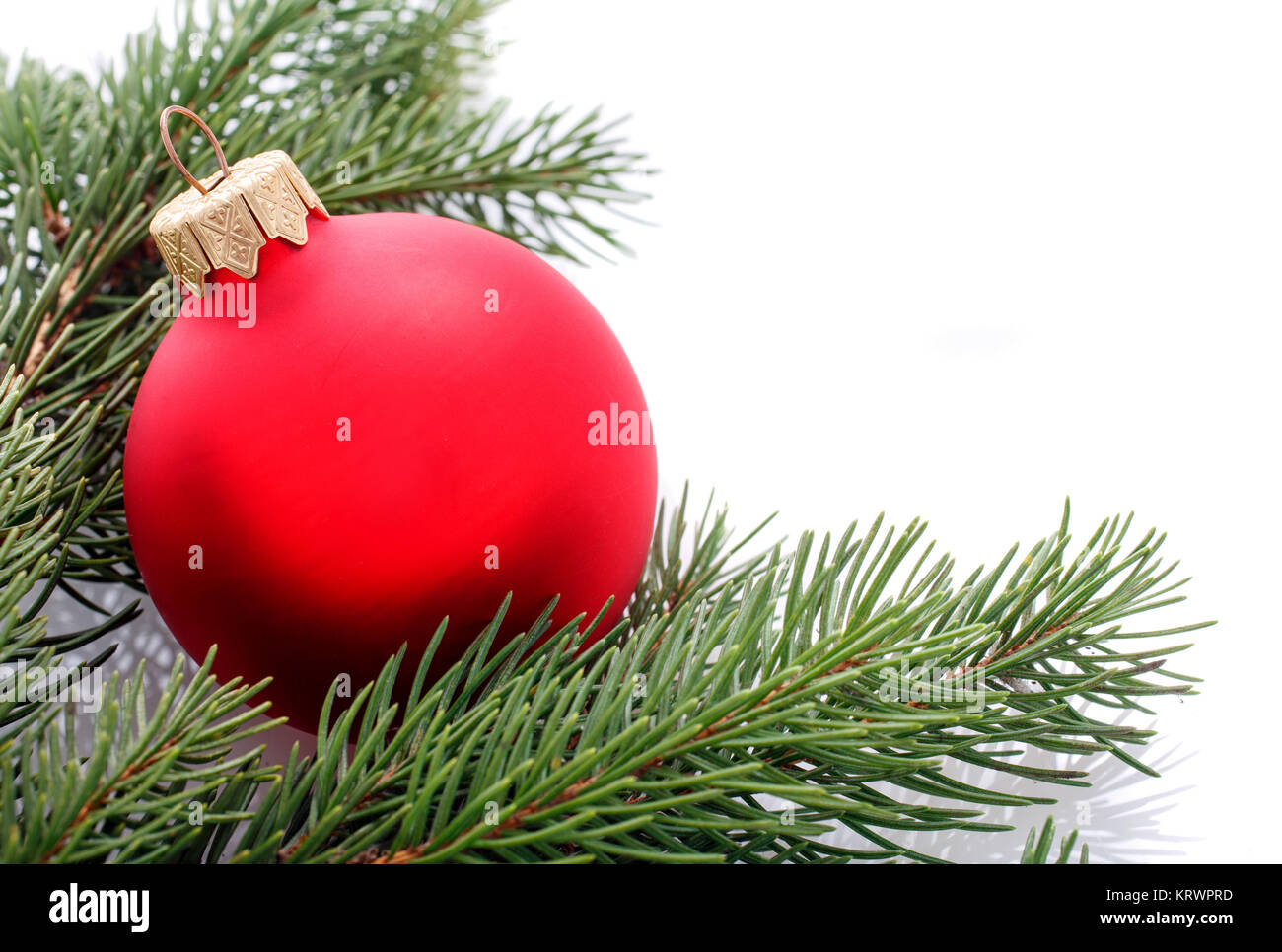 red Christmas ball and fir branches isolated on white Stock Photo - Alamy