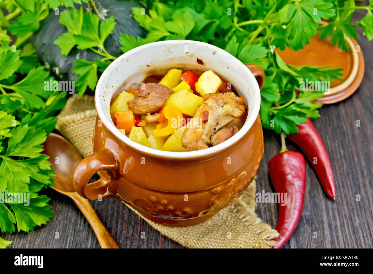 Roast meat and potatoes in portion pot on board Stock Photo Alamy