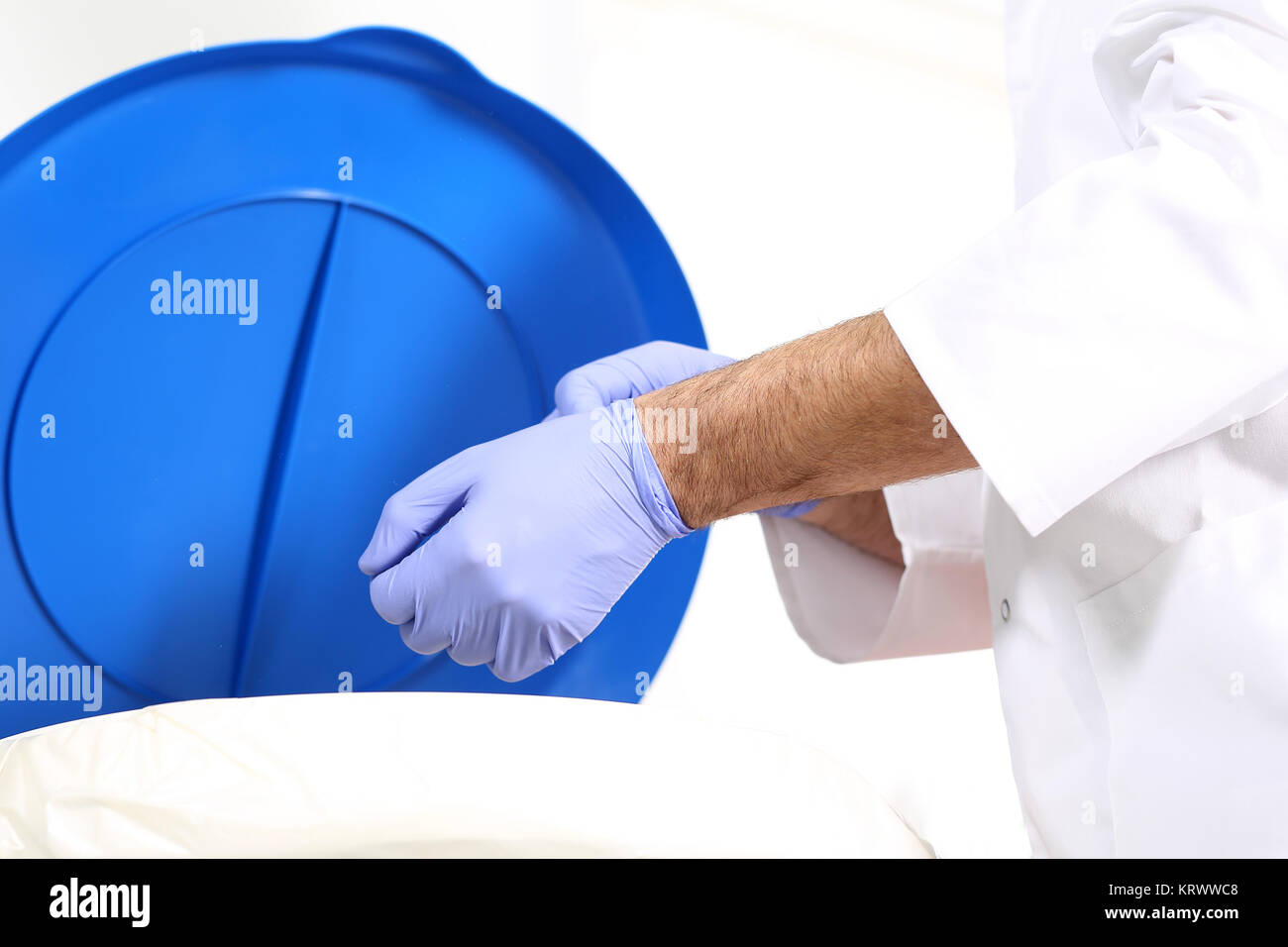 medical waste,doctor surgeon throws gloves into a special waste container Stock Photo