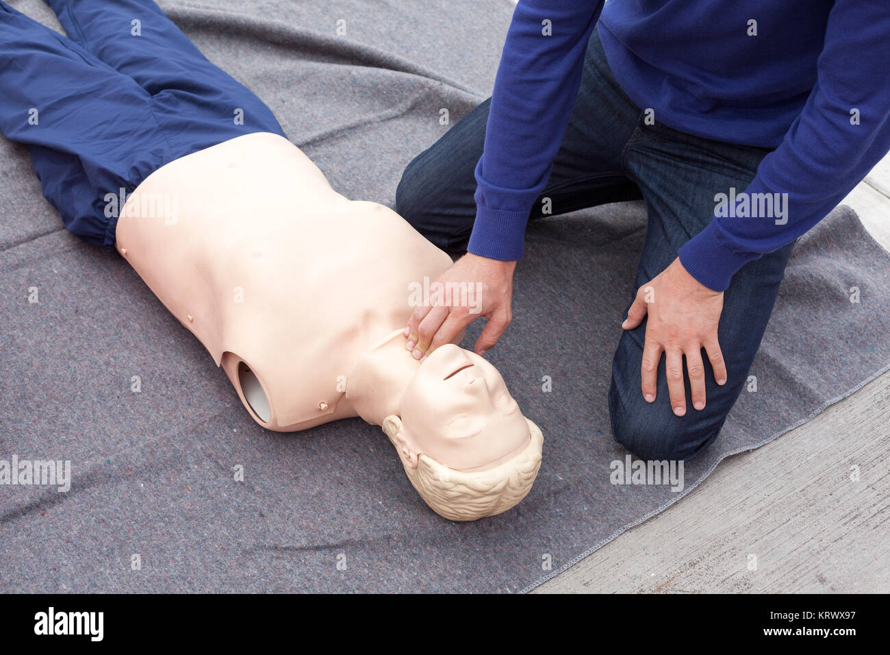Checking pulse. First aid training Stock Photo - Alamy