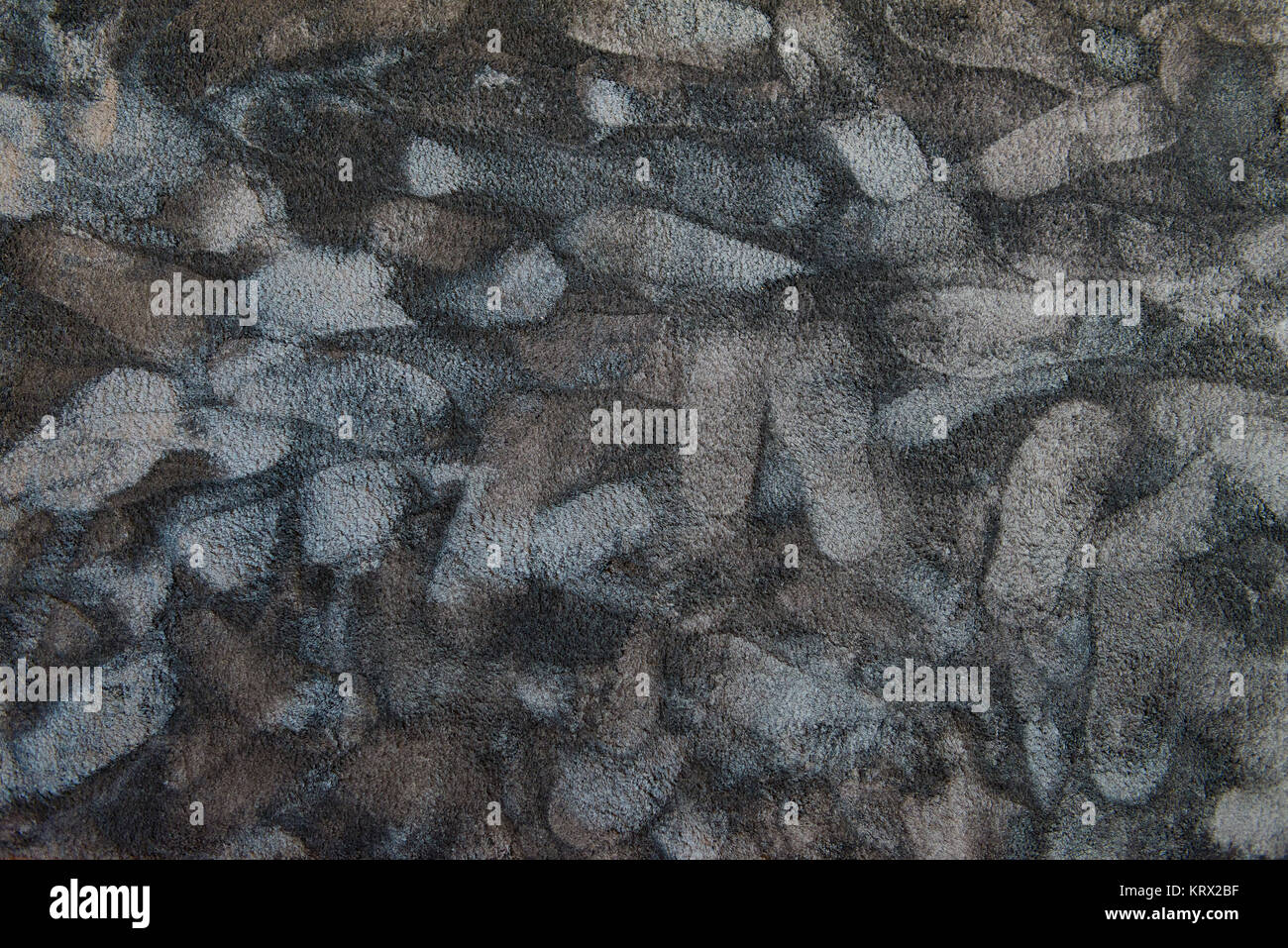 Footsteps pattern on synthetic rug Stock Photo - Alamy