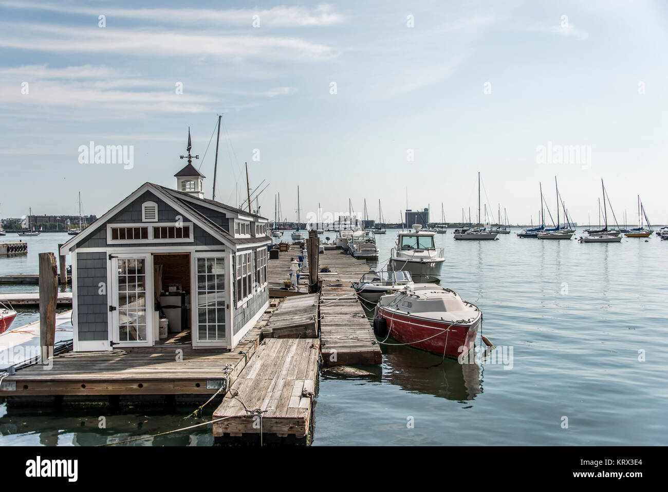 Rows of sailing boats and luxury yachts anchored in Boston harbor