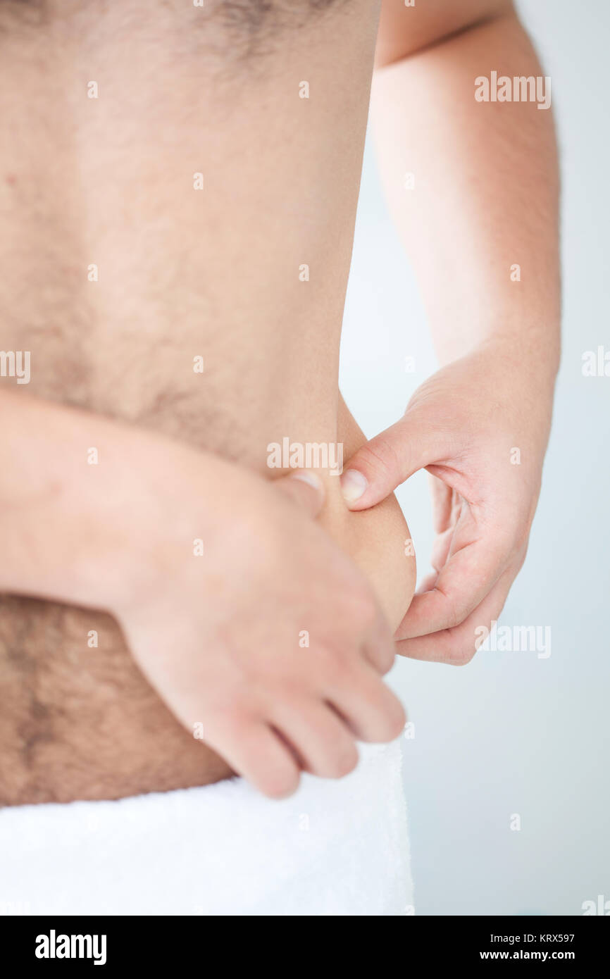 Localized fat in man abdomen Stock Photo