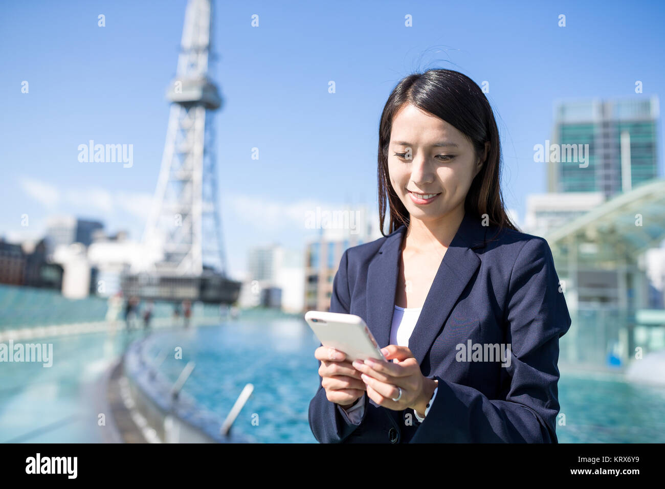 Asian businesswoman use of mobile phone Stock Photo - Alamy