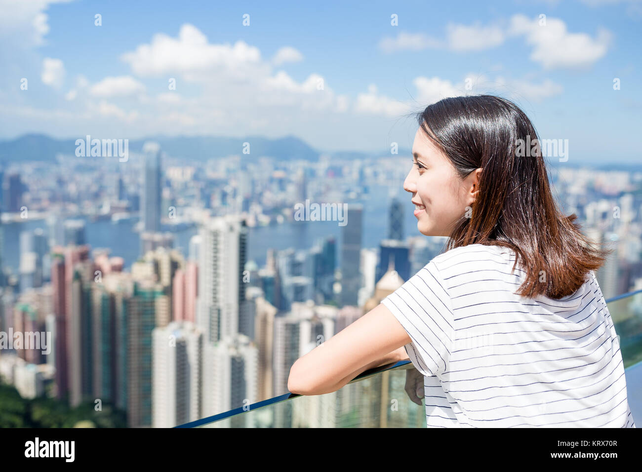Woman looking at the view of Hong Kong Stock Photo - Alamy