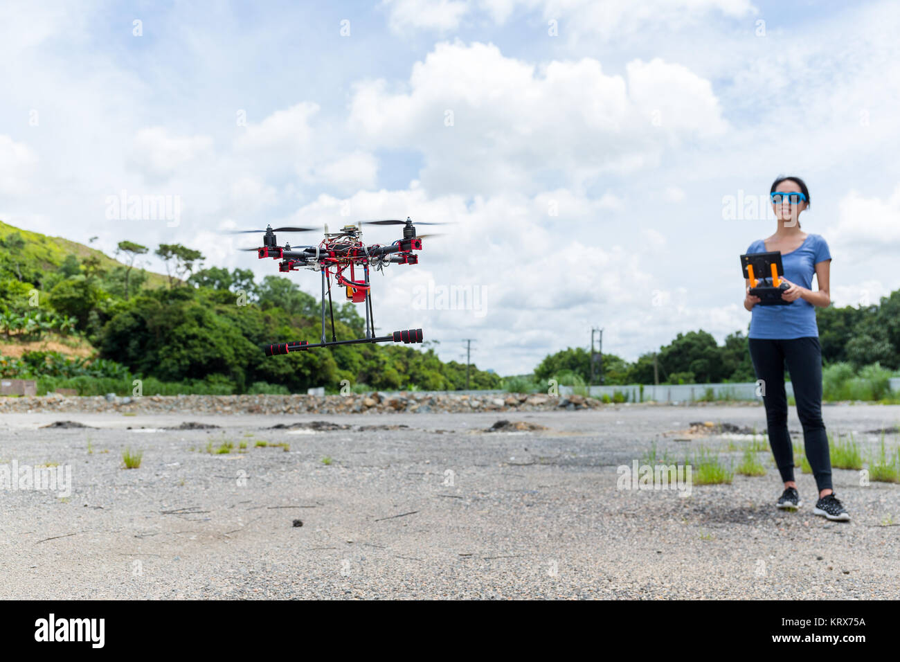 Woman play with drone Stock Photo - Alamy