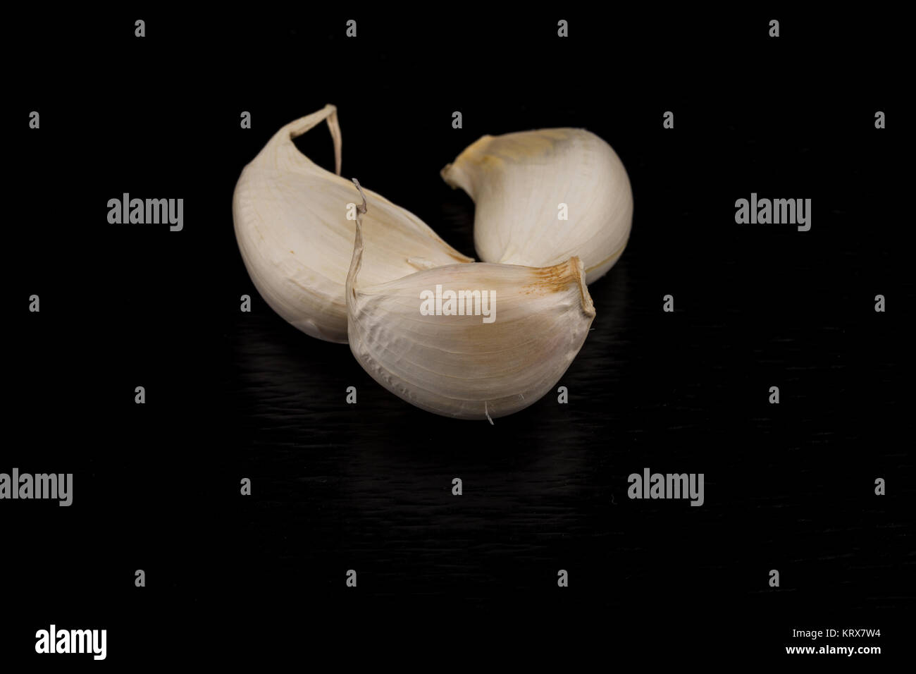Garlic bulb on dark background Stock Photo - Alamy