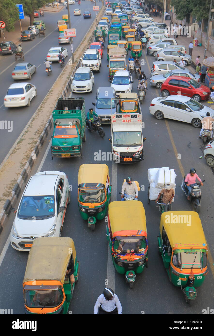 People commute in downtown New Delhi India Stock Photo